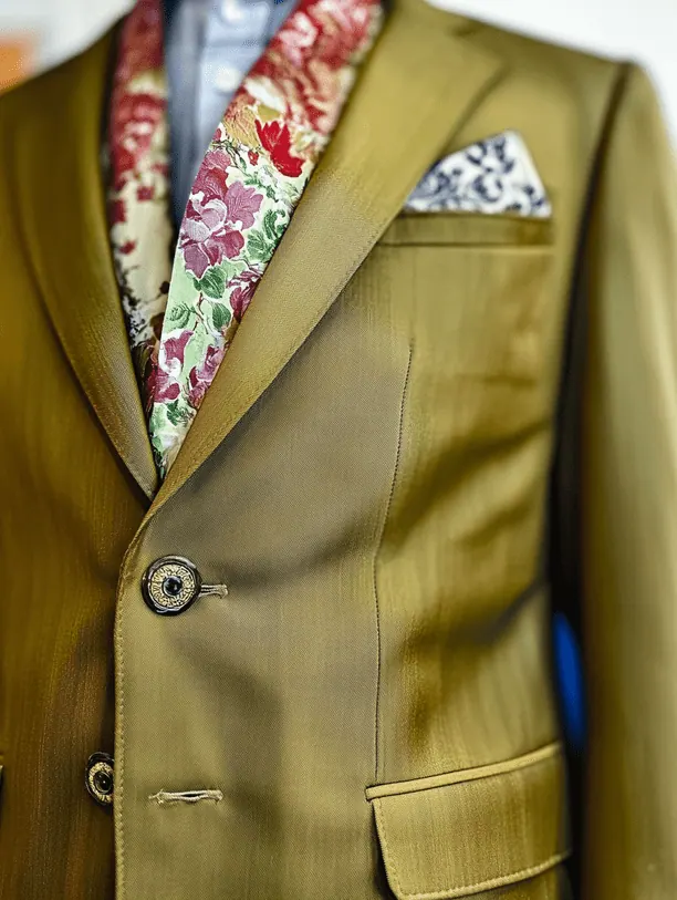 Close-up of a lightweight suit jacket and trousers built for a tropical climate